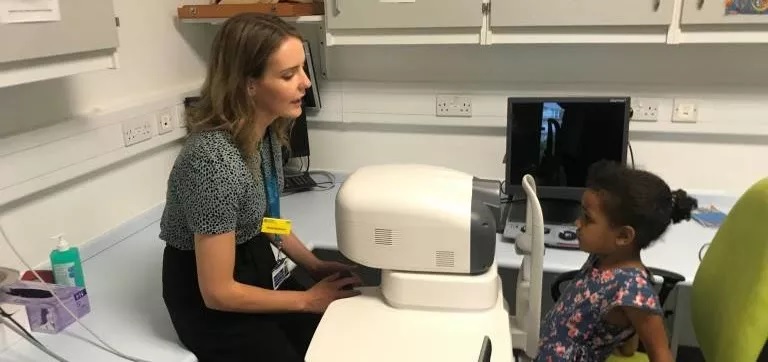 Child having an eye scan