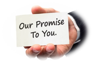 A hand holding a sign
Description automatically generated with medium confidence