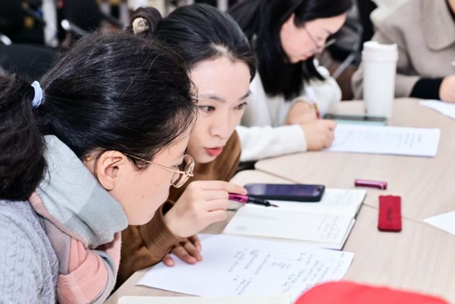 Participants refining their research questions and Week One action commitments during the workshop.