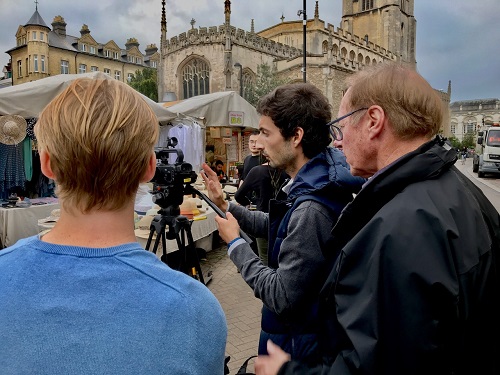 Cambridge TV Training tutor with participants filming in central Cambridge