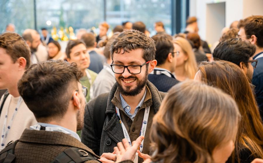 a crowd of people networking 