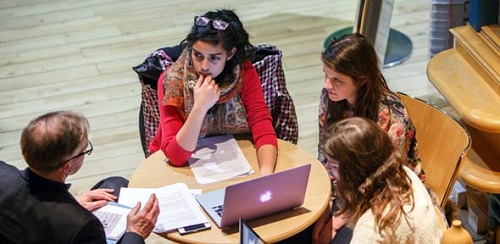 Students and tutor in a discussion group