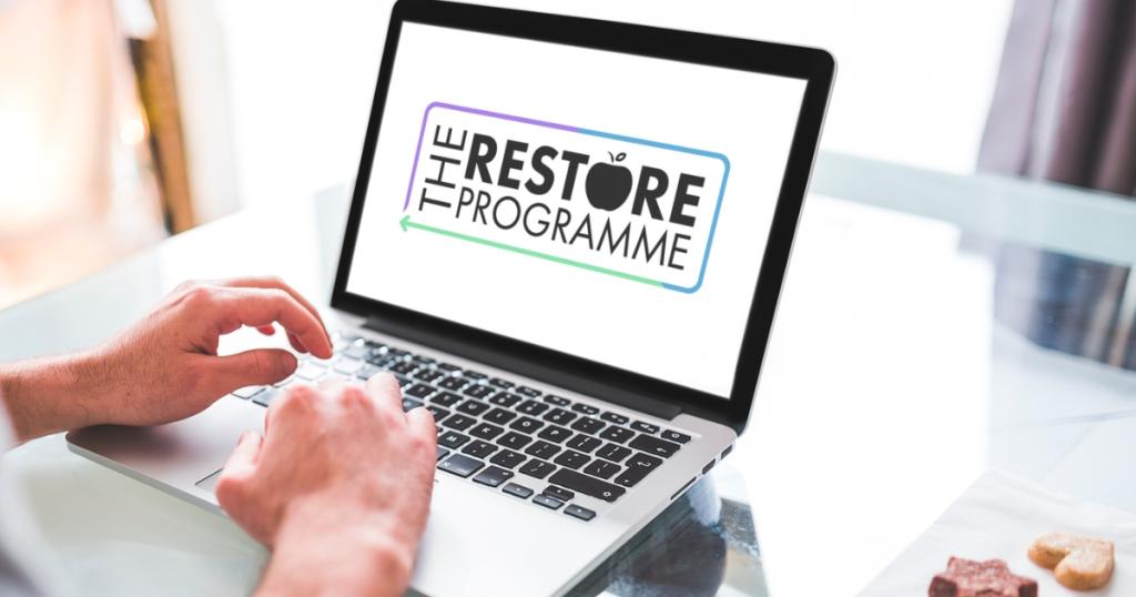 and laptop with the words the restore programme