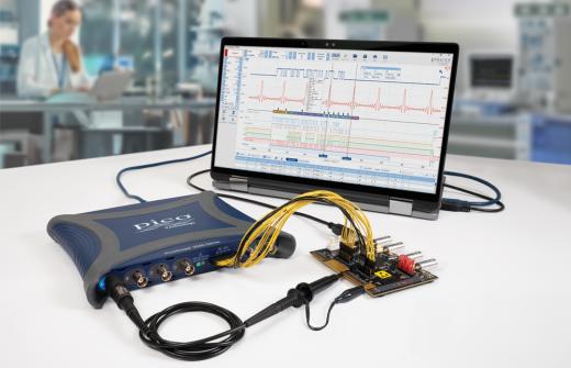 PicoScope 3418E MSO oscilloscope connected to a demo board and a PC-laptop 