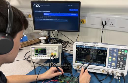42T engineer wearing wireless headset and demonstrating voice-activated control of lab instrument