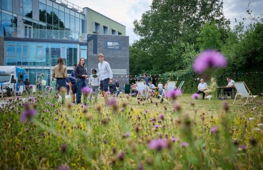 Allia tenants mingling on the lawn of Cambridge Campus business centre