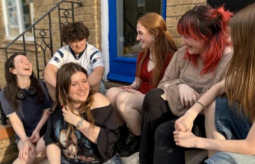 Young people laughing on steps
