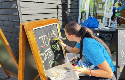 Volunteer creating a sign