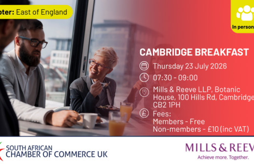 Promotional graphic for the South African Chamber of Commerce UK Cambridge Breakfast event. The image shows three professionals having breakfast and networking in a modern office environment beside large windows. Event details are displayed on a red gradient overlay: Thursday 23 July 2026, 07:30–09:00, at Mills & Reeve LLP, Botanic House, 100 Hills Rd, Cambridge CB2 1PH. Fees are free for members and £10 including VAT for non-members. A yellow “In person UK” badge appears in the top right corner, with the S