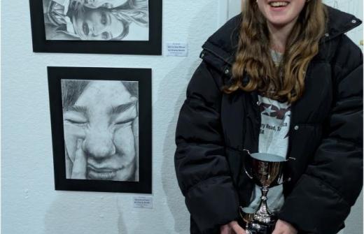 Lower Sixth pupil Charly S and her winning piece, Girl in the Mirror. 