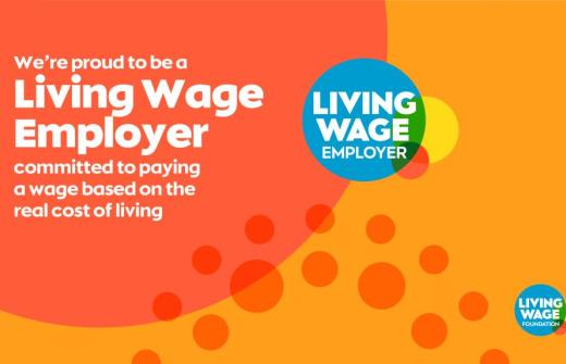 Graphic reads we're proud to be a living wage employer committed to paying a wage based on the real cost of living