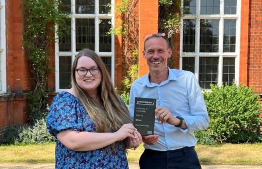 Meet Cambridge's Sarah Maycock and Andrew Bell with the Green Impact Silver award stading outside Newnham College, Cambridge