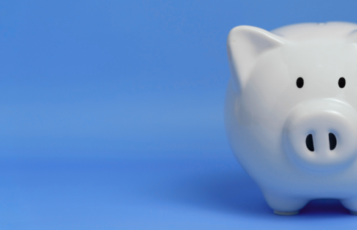 A white piggy bank against a blue background