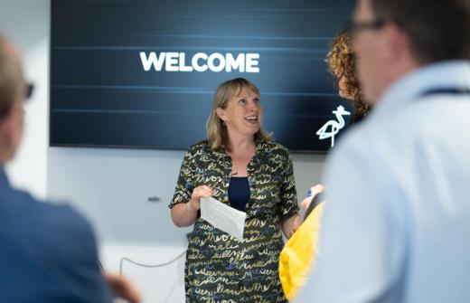 A female talking to a group of people