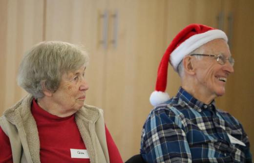 Two carers enjoy a Christmas party
