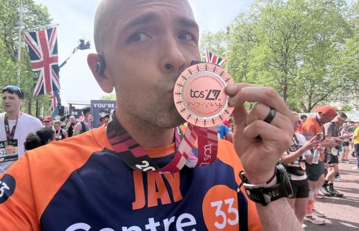 A Centre 33 runner, kissing his medal after completing the 2026 TCS London Marathon 