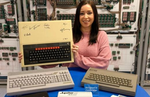 Centre for Computing History Archivist Kate Stockwell displays a signed Acorn Computers BBC Micro and other computing hardware developed in Cambridge. 