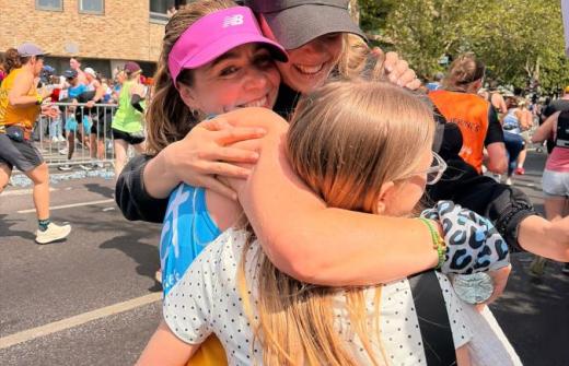 Lizzie hugging family after running London Marathon for Addenbrooke's Charitable Trust
