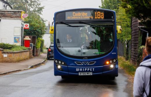 A bus pulling in to pick someone up