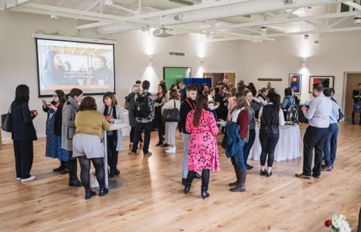 A diverse group of professional people networking at Jesus College Cambridge