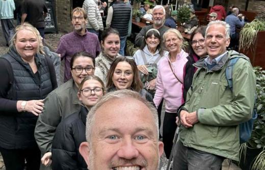 A scene showing an engaged and enthusiastic group on the walking tour