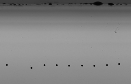 Image shows ink droplets - part of Meteor's Inkjet Nozzle Health Technology