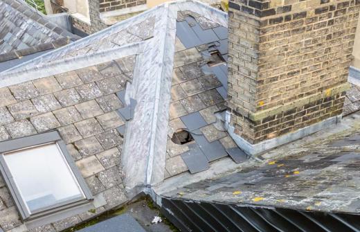 Drone roof survey photo showing extensive damage to roof tiles