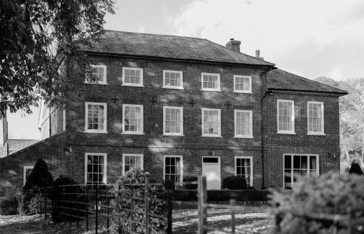 A black and white image of the Manor House