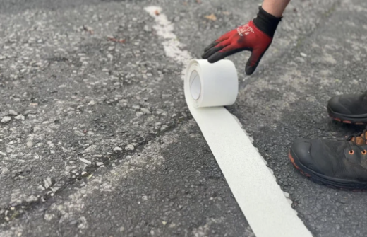 Thermoplastic line marking Roll being rolled out in preparation to be applied with heat