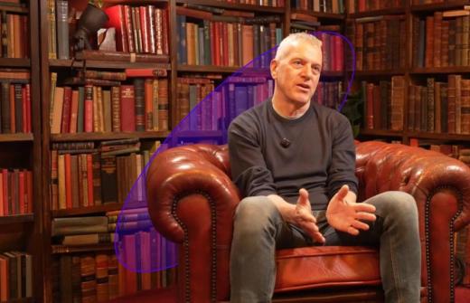 Stan Boland sits for an interview with Amadeus Capital Partners in a library. 
