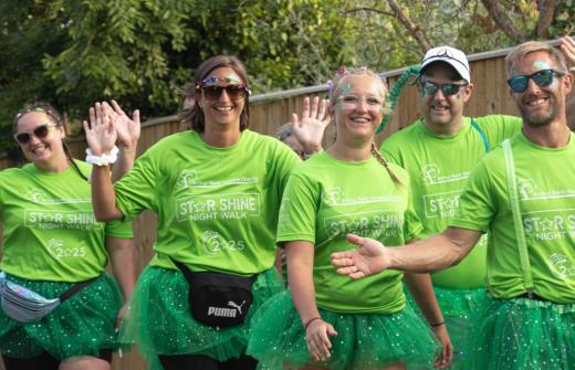 Male and females walkers dressed in green