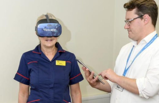 Nancy Burridge and Dr Ben Clark from the palliative team demonstrating the virtual reality headset