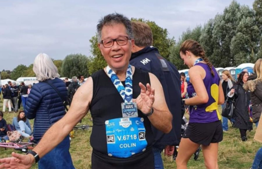 A previous Cogwheel runner displaying his medal