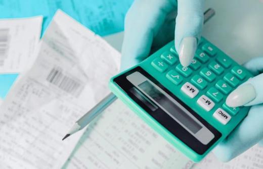 A woman using a a calculator