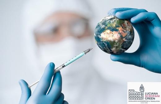 masked person injecting a mini 'globe' 
