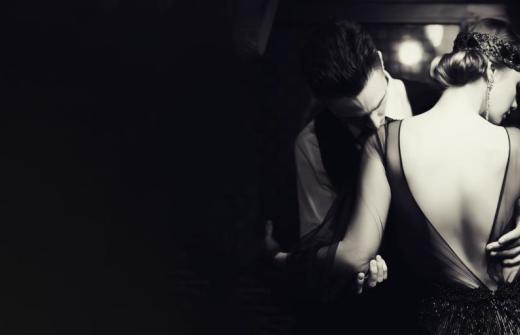 A man and woman embrace.