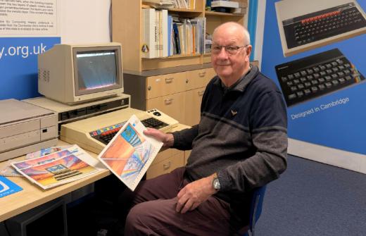Chris Turner from Acorn is pictured sitting in front of a working Domesday System at The Centre for Computing