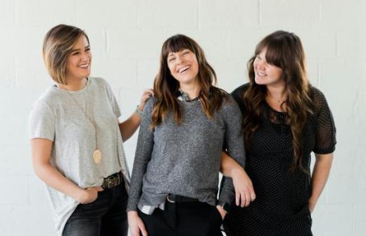 3 women smiling and laughing
