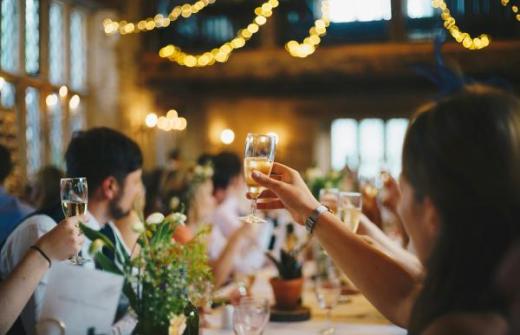 People doing a cheers at a party