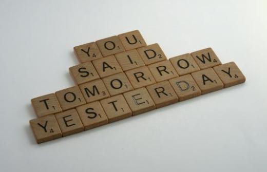 scrabble tiles saying you said tomorrow yesterday
