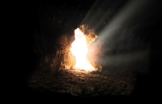 a cave with the light shining through