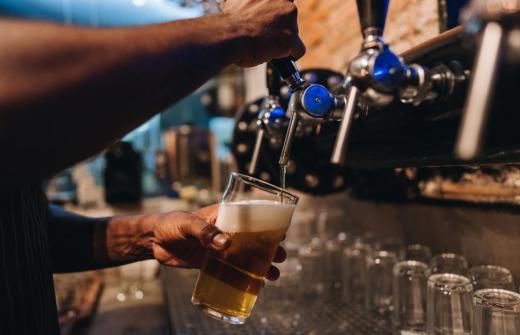 A pint being poured in a pub