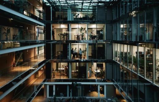 An large office block, lit up at night