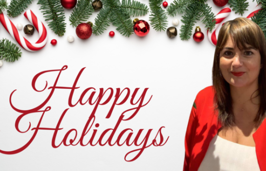 Christmas decor with the words Happy Holidays and image of Luciana Scrofani Green in a red blazer