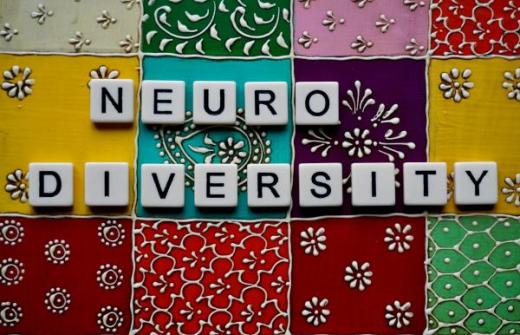 a colourful background with different patterns with scrabble letters spelling neurodiversity