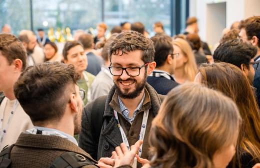 a crowd of people networking 