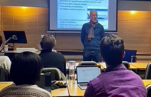 Simon lecturing a group