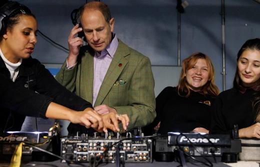 Duke of Edinburgh with headphones and crew members at the sounddesk