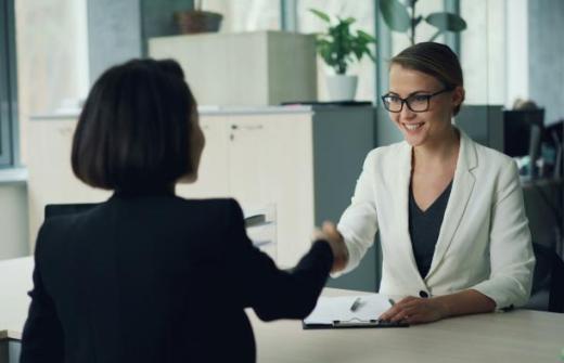 Business women shaking hands in an office
