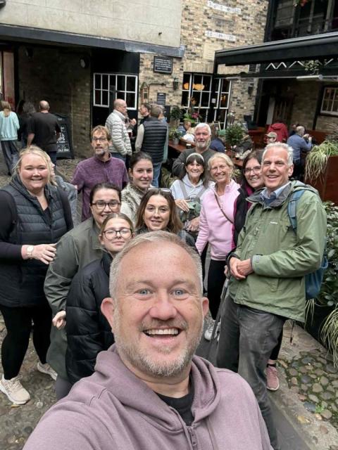 A scene showing an engaged and enthusiastic group on the walking tour